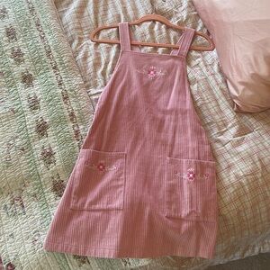 XS Pink, corduroy overall dress with embroidered flowers.